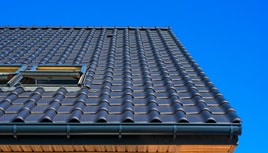 vertical-low-angle-closeup-shot-black-roof-building_small